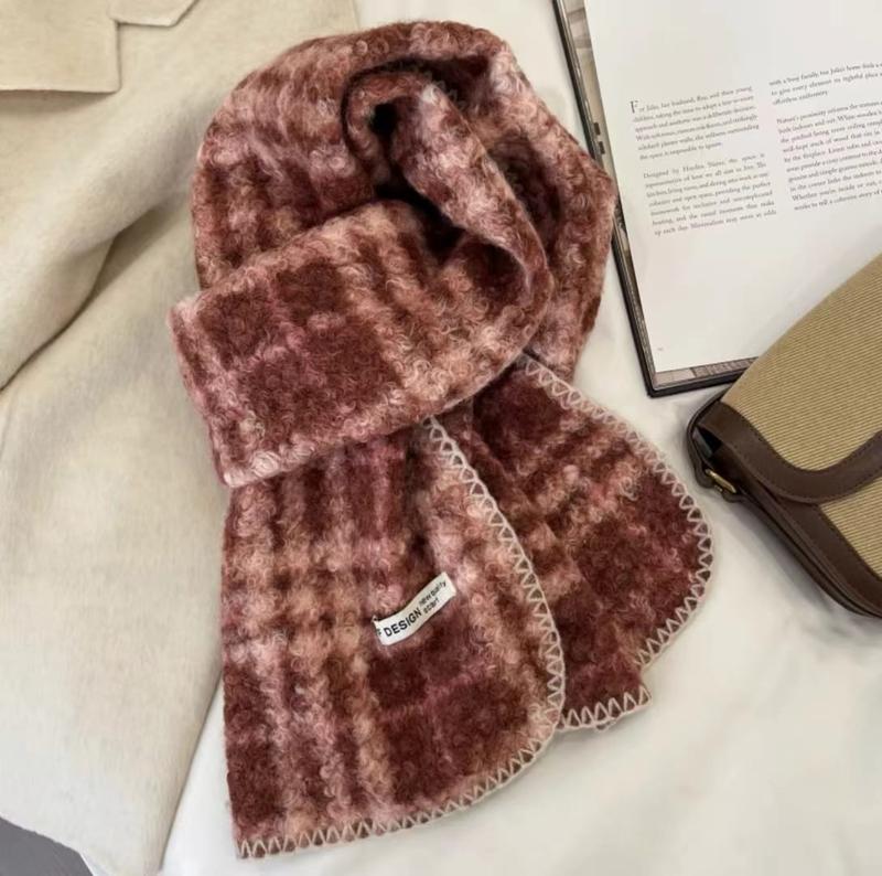 Cozy rose pink and burgundy plaid mohair blend scarf with cream blanket stitch edges, styled with a book and handbag