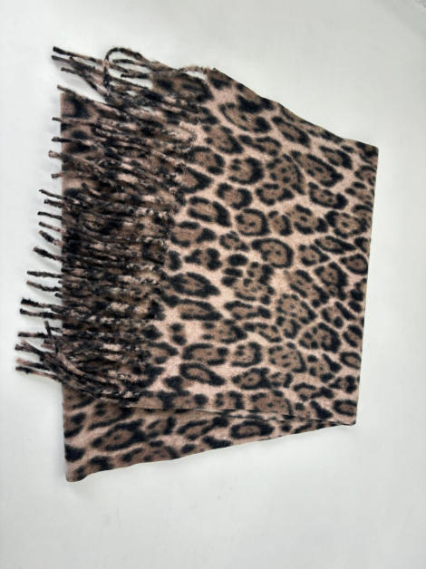 Folded beige and brown leopard print soft scarf with tassel fringe trim on white background