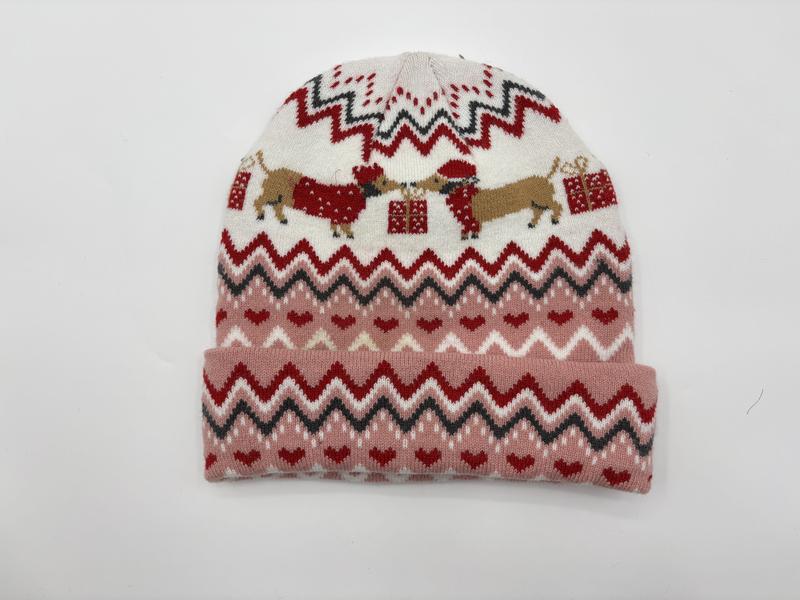 Pink and cream knit beanie hat with Fair Isle chevron pattern featuring dachshund dogs in Santa hats and red hearts
