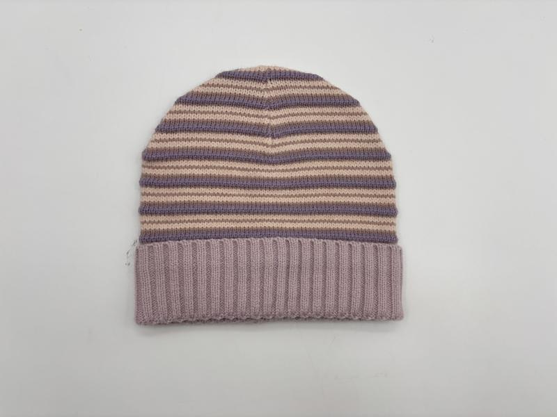 Knit beanie hat with purple and beige horizontal stripes and a solid lavender ribbed fold-over cuff, flat lay on white background