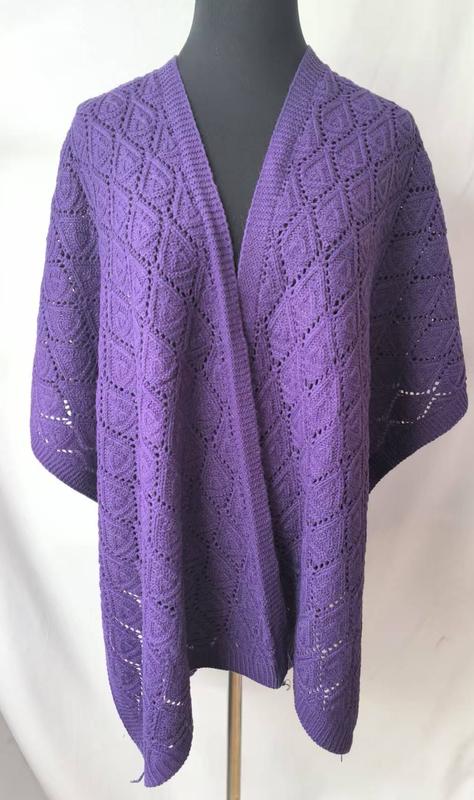 Purple lace knit open-front wrap shawl with diamond cable pattern displayed on a mannequin, full length view