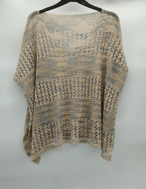 Beige and teal open-knit crochet batwing sleeve top with stripe pattern and large holes, displayed on hanger