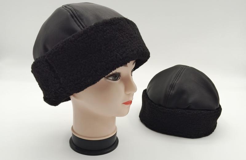 Black faux leather winter beanie hat with sherpa fleece band shown on mannequin head and standalone, unisex cold weather cap