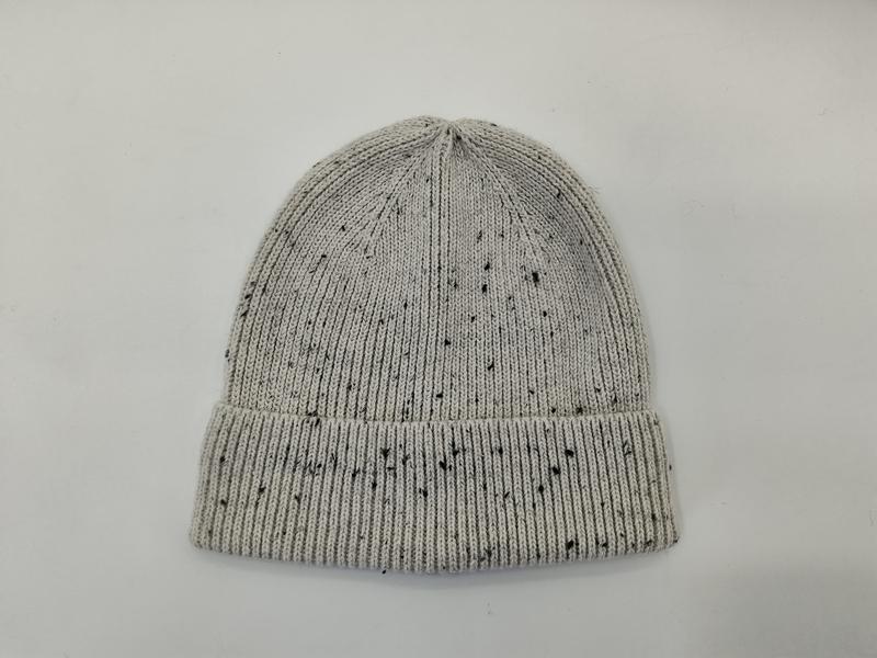 Light grey ribbed knit beanie hat with black speckle fleck pattern and folded cuff, laid flat on white background