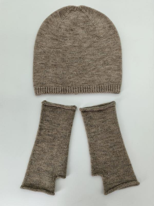 Taupe heathered knit beanie hat and fingerless gloves set laid flat on white background