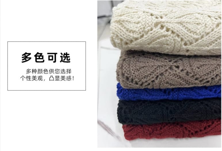 Stack of five folded chunky hollow-knit throw blankets in cream, taupe, royal blue, black, and burgundy red