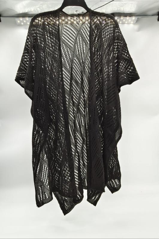 Black open-weave crochet kimono cardigan with diagonal lace pattern hanging on a hanger against white background