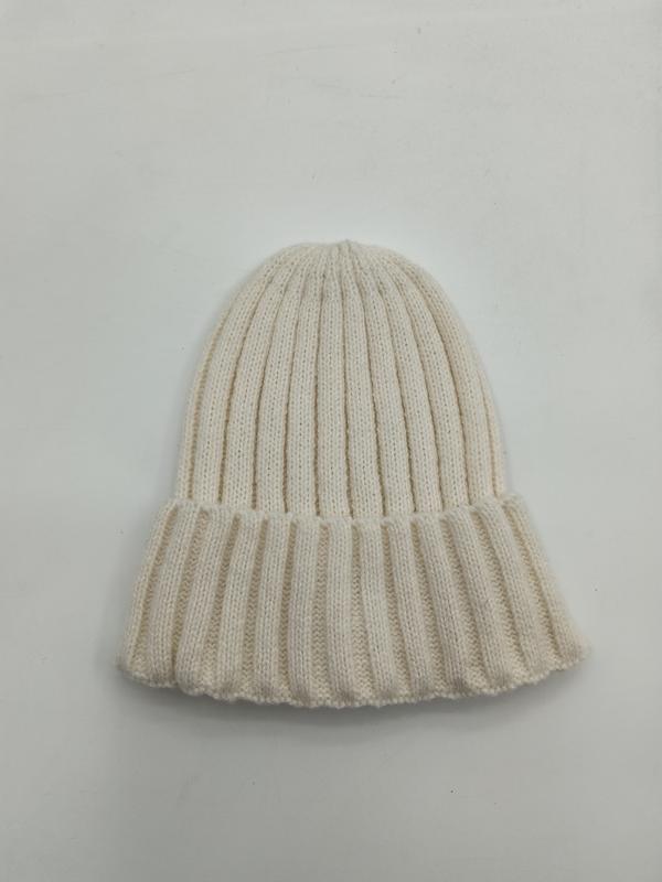 Cream off-white ribbed knit winter beanie hat with folded cuff brim, laid flat on white background