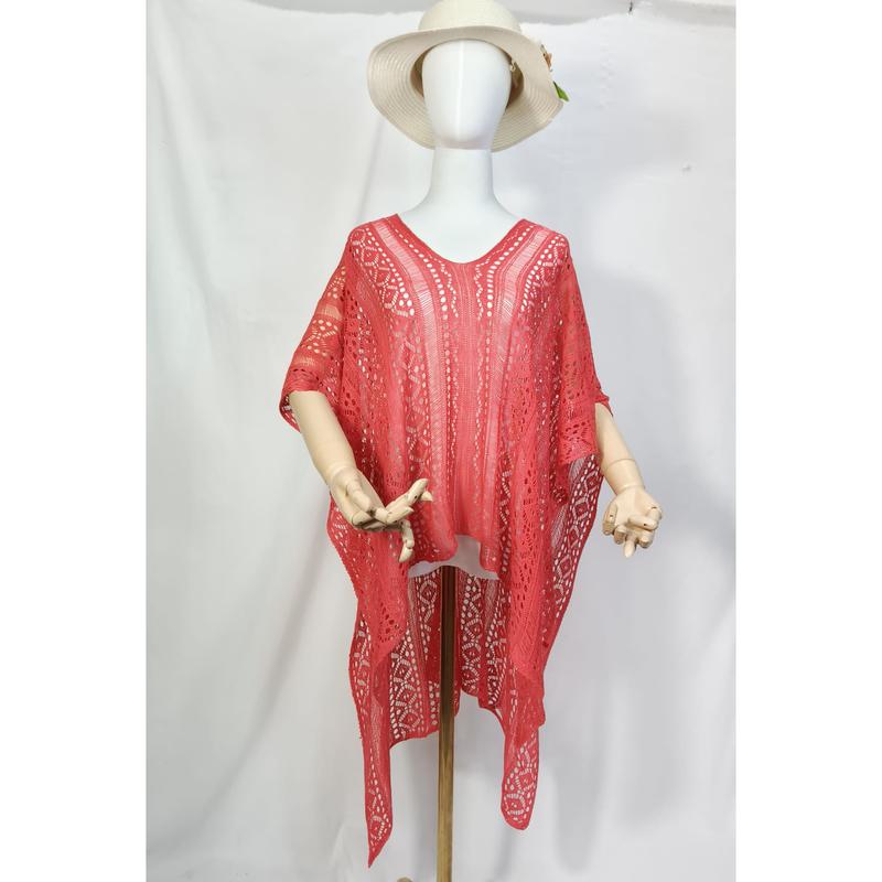 Coral red crochet lace kaftan poncho displayed on mannequin with white sun hat, open weave bohemian beach cover-up