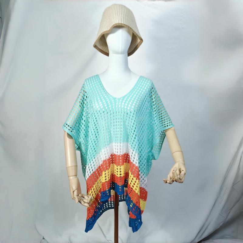 Mannequin wearing teal crochet mesh beach poncho with rainbow chevron stripe hem and beige bucket hat