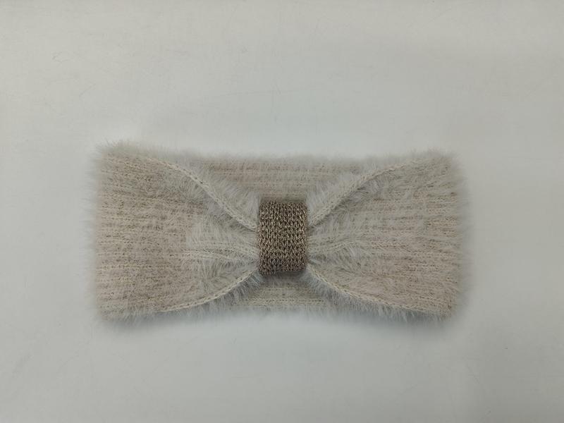 Beige fuzzy knit ear warmer headband with gold metallic crochet center band, flat lay on white background