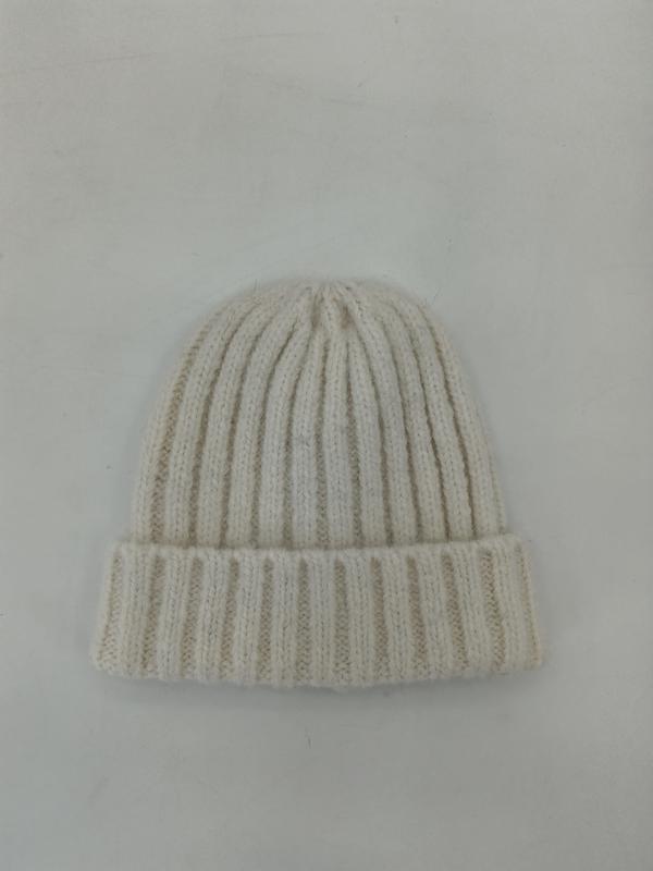 Cream off-white ribbed knit winter beanie hat with folded cuff, laid flat on white background