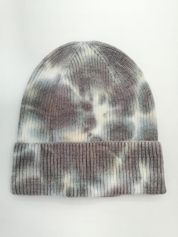 Ribbed knit beanie hat with tie-dye pattern in grey, cream, and brown tones, featuring a folded cuff