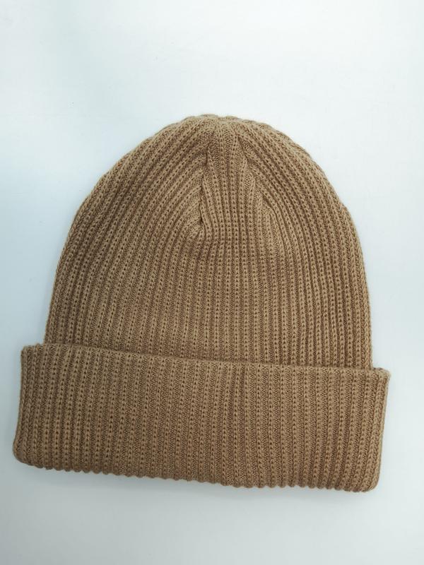 Camel tan ribbed knit beanie hat with folded cuff, laid flat on white background