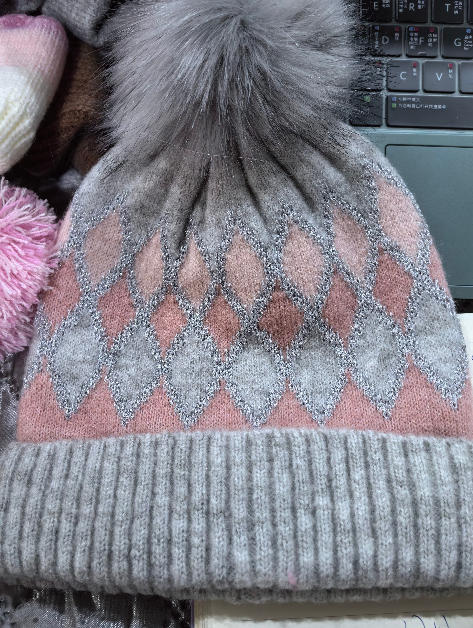 Gray and pink argyle pattern knit winter beanie hat with large faux fur pom pom on top