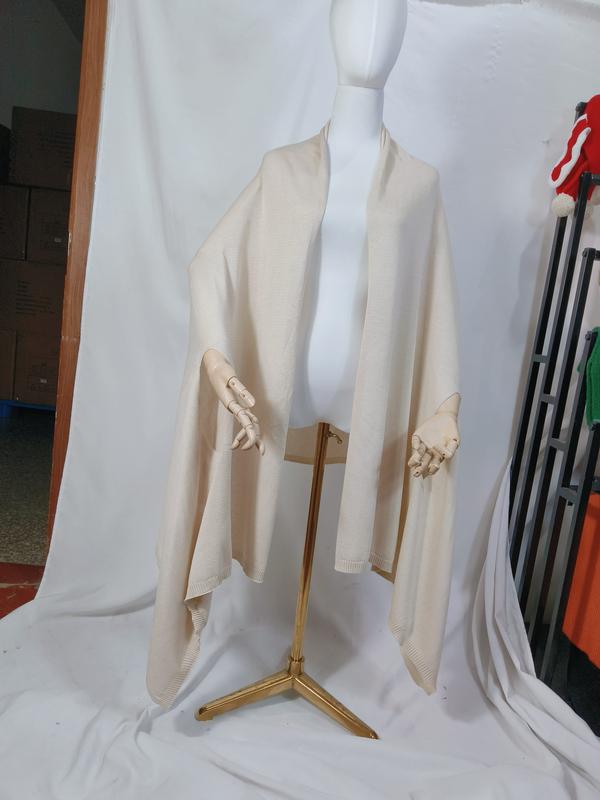 Cream ivory fine knit open-front wrap shawl draped on mannequin, ribbed hem detail, oversized silhouette