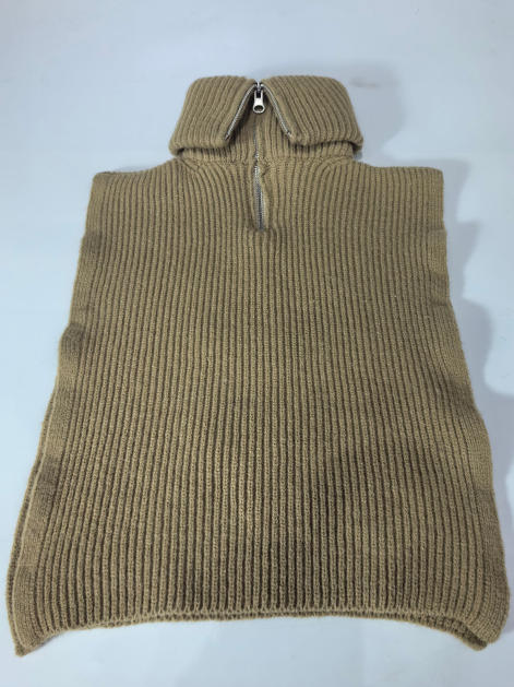 Camel beige ribbed knit sleeveless poncho sweater vest with silver half-zip turtleneck collar, laid flat on white background