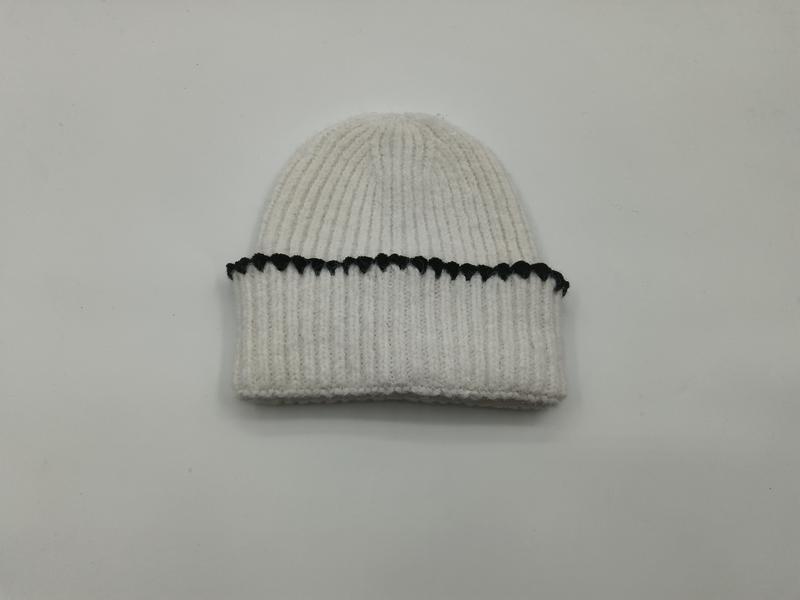 Cream white chunky ribbed knit winter beanie hat with folded cuff and black contrast whipstitch detail stripe