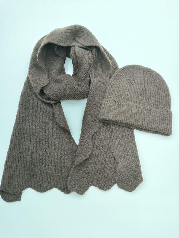 Taupe ribbed knit winter scarf with scalloped hem and matching cuffed beanie hat set on light background