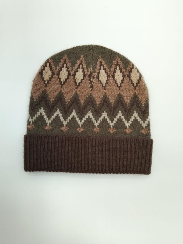 Brown olive and cream Fair Isle patterned knit beanie hat with ribbed cuff and diamond zigzag design on white background