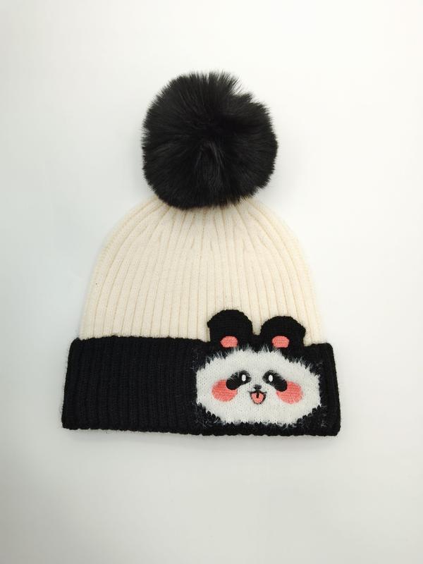 Cream and black ribbed knit winter beanie hat with cute panda face patch and large black faux fur pompom on top