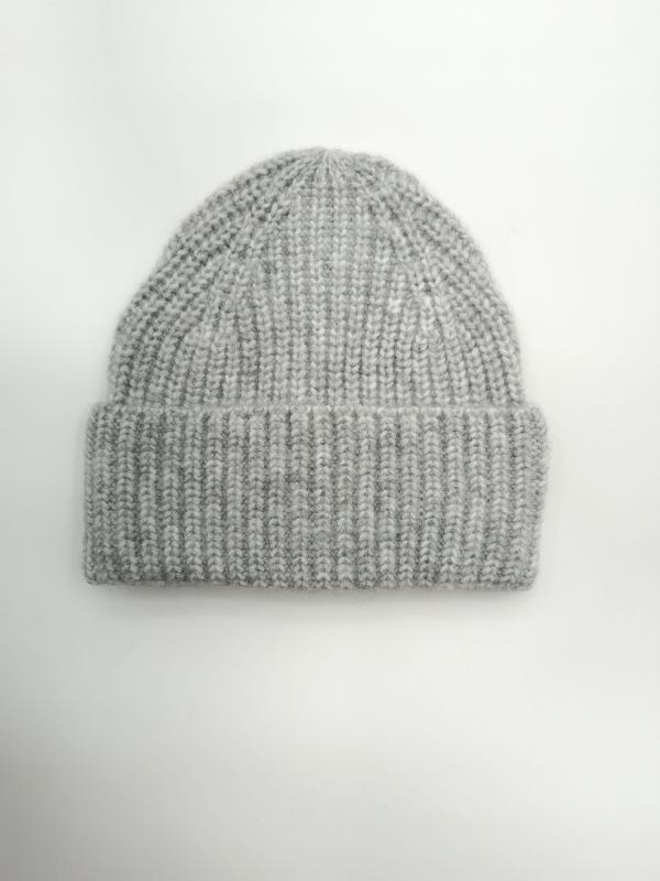 Light grey chunky ribbed knit beanie hat with folded cuff, laid flat on white background, soft wool blend